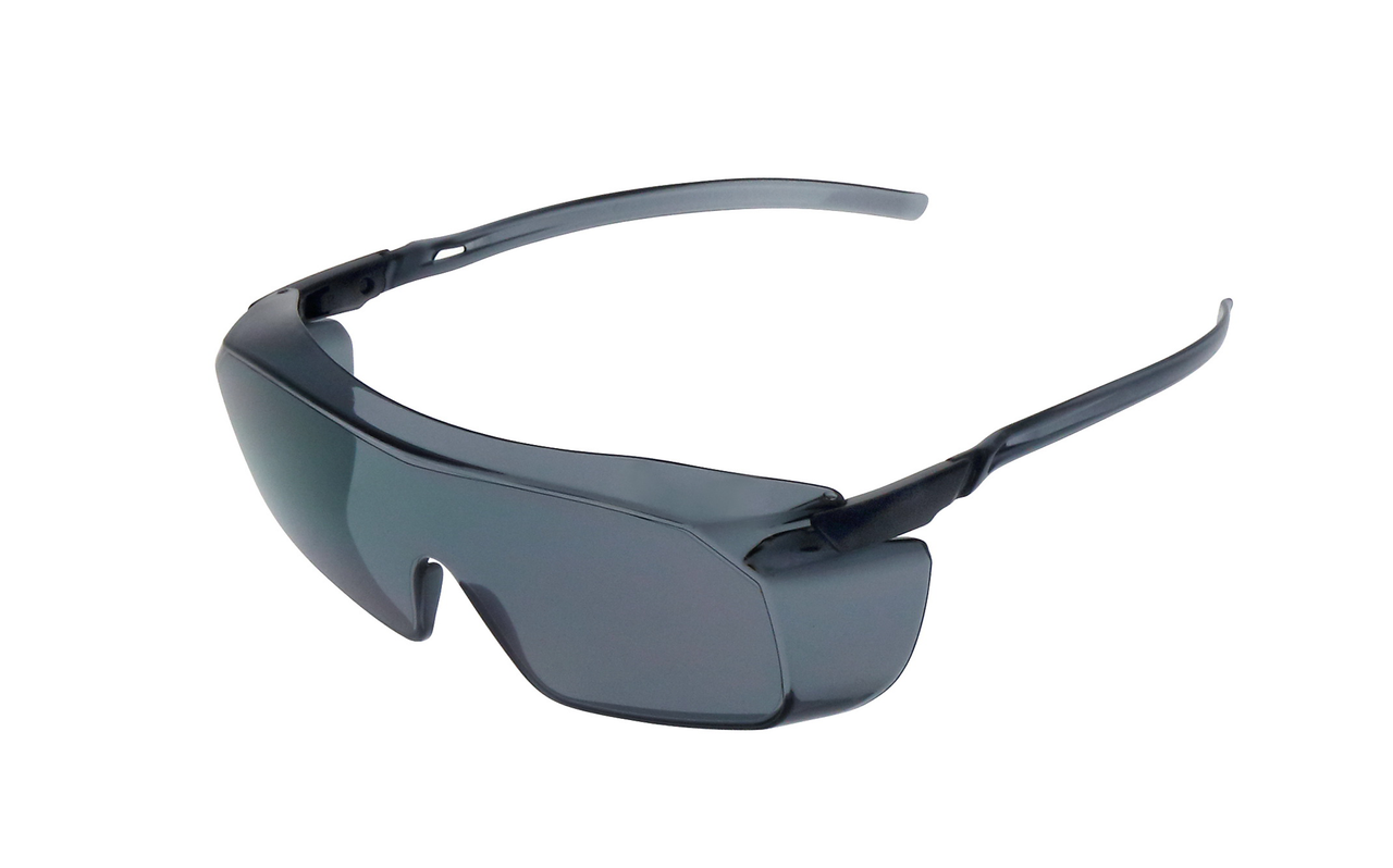 Gray lens low-profile frameless safety glasses with dark temples, angled front view